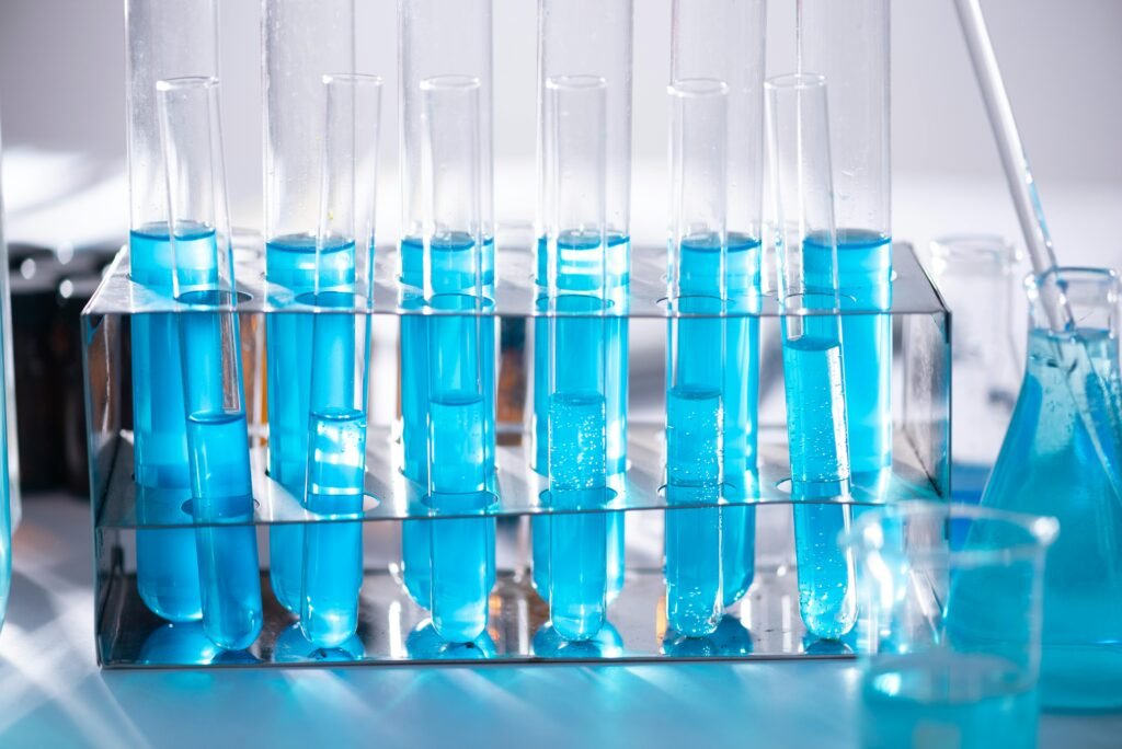 pexels photo 2280549 2280549 Close-up of blue liquid in test tubes for chemistry experiments in a laboratory setting.